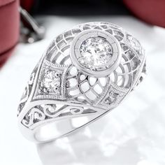 Elevate your jewelry collection with this exquisite Vintage Estate Ring, showcasing a radiant White Cubic Zirconia centerpiece. Adorned with delicate White CZ accent stones, this piece exudes timeless elegance. Expertly crafted in 925 Solid Sterling Silver, each ring bears the hallmark 'Stamped 925' as a testament to its authenticity and quality. This filigree ring is a testament to classic craftsmanship, making it a sophisticated addition to any ensemble.  Excellent Condition/Like New. Medicine Wallpaper, Hairstyles Retro, Beautiful Wedding Jewelry, Unique Silver Jewelry, Antique Filigree, Dome Ring, Popular Jewelry, Sterling Silver Filigree, Filigree Design