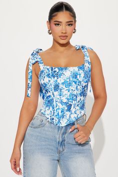 Available In Blue/combo. Corset Top Sleeveless Tie Shoulder Boning Square Neck Back Zipper Closure Printed Fully Lined Non Stretch Disclaimer: Print Placement May Vary. Self: 96% Polyester 4% Spandex Lining: 95% Polyester 5% Spandex Imported | Belmont Corset Top in Blue size XS by Fashion Nova Blue Printed Tank Top For Summer, Blue Printed Sleeveless Top, Blue Floral Print Tank Top For Summer, Printed Cotton Blue Tank Top, Blue Printed Cotton Tank Top, Printed Blue Cotton Tank Top, Blue Floral Print Cotton Tank Top, Shoulder Bones, Service Women