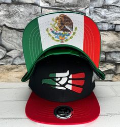 Hecho En Mexico Snapback Hat Snapback Adjustment. one size Adjustable cap 60% Cotton 40% polyester  a stylish cap for any occasion, a perfect gift for a special person ⚠️Shipping Information⚠️ We ship all of our hats in a box in order to prevent the hat from getting damaged.  I cannot guarantee a delivery date. Items usually take up to 5 business days to be delivered but please keep in mind that USPS can delay a package if they reach an inconvenience on their end. If you have not received your item but the tracking says delivered, I recommend contacting your local post office as soon as possible to find out the location of your item. Sometimes packages can get misplaced or might be held at the post office. Multicolor Snapback Hats For Sports Events, Multicolor Flat Brim Snapback Hat One Size, Multicolor Snapback Hat One Size, Customizable Multicolor Snapback Trucker Hat, Mexican Flag Colors, Snapback Hat, One Size, Made In Usa, Military Style Adjustable Snapback Trucker Hat, Military Green Snapback Hats, Military Cotton Snapback Hat