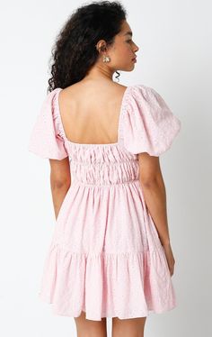 Get ready to feel fabulous in the Kendall Pink Eyelet Puff Sleeve Mini Dress! It's sure to bring a playful and fun vibe to your wardrobe. This puff sleeve mini dress is made from pink and cream pierced eyelet lace fabric, with a smocked corset-inspired bodice, a square neckline, and an attached tiered mini skirt. Style with heels for an elevated look! DETAILS & FIT S: 30" length, 25" waist, 32" bust M: 30.5" length, 27" waist, 33" bust L: 31" length, 29" waist, 35" bust 100% Cotton. Machine wash Feminine Mini Dress With Balloon Sleeves For Day Out, Feminine Balloon Sleeve Mini Dress For Day Out, Pink Ruffled Square Neck Mini Dress, Cotton Mini Dress With Balloon Sleeves, Cute Square-neck Puff Sleeve Dress For Spring, Pink Puff Sleeve Dress With Ruffles, Pink Flirty Puff Sleeve Dress With Ruffles, Flirty Pink Puff Sleeve Dress With Ruffles, Balloon Sleeve Mini Dress With Ruffles For Day Out