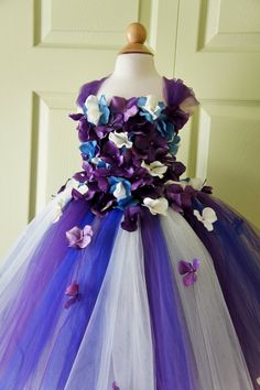 a dress made out of tulle with flowers on it