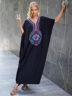 The "All You Need Women's Rayon Black Kaftan Dress" is a stylish and versatile garment designed specifically for women. Made from high-quality rayon fabric. this kaftan dress offers a luxurious and comfortable feel against the skin. The dress features a classic black color. which adds an element of sophistication and elegance to any outfit.With its loose and flowy design. the kaftan dress provides a relaxed and effortless fit. making it suitable for various body types. It is designed to be worn Black Kaftan Dress, Morrocan Fashion, Embroidered Robe, Beach Wardrobe, Black Kaftan, Stylish Loungewear, Embroidered Robes, Plus Size Beach, Beach Kaftan