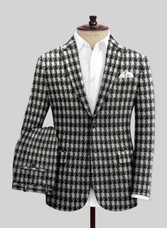 Unveil our Highlander BW Bold Box Tweed Suit - a marvel piece for the trailblazing tastemaker. Meticulously tailored from pure wool, this sumptuous tweed fabric delivers both coziness and refinement while flaunting a captivating black-and-white plaid motif. The design marries timeless grace with a fresh, modern twist, making it the go-to choice for those aiming to leave an indelible mark at any occasion. Whether it’s a strategic boardroom session or an upscale gathering, this suit has got you covered.

Look Includes

Highlander BW Bold Box Tweed Fabric
Two Button Jacket Style
Notch Lapel
Horn Royal Black Buttons
Single Vent
Three Cuff Buttons
Two Welted Back Pockets on Trousers Tweed Suit, Tweed Suits, Button Jacket, Tweed Fabric, Wool Suit, Italian Fabric, Suit Shop, Double Breasted Suit, Jacket Buttons