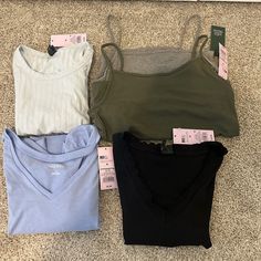 Wild Fable Shirts All Size Medium, All Brand New With Tags. Will Come With These 5 Shirts/Tank Tops. Includes: 1 Blue V-Neck Short Sleeved Shirt, 1 Black Short Sleeved Shirt, 1 Blue Short Sleeved Shirt With Open Back, 1 Gray Tank, And 1 Green Tank. No Damage Rips Or Tears. Never Been Worn Casual Camisole Tops For Loungewear, Casual Camisole Top For Layering, Casual Layering Camisole Crop Top, Casual V-neck Crop Top For Layering, Basic Camisole Tops For Loungewear, Casual Loungewear Crop Top Camisole, Casual Cami Tops For Layering, Trendy Camisole Top For Loungewear, Basic Spring Camisole Tops