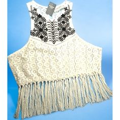 Get Ready To Turn Heads With This Stunning Abercrombie & Fitch Lace Top. The Top Features A Round Neckline, Sleeveless Design, And Button Closure. Available In Size L And Ivory Color, This Regular-Fit Top Is Perfect For Party/Cocktail Or Casual Occasions. Accentuated With Fringe, Beaded, And Embroidered Details, This Cropped Top Has A Beachy, Rock, Hippie, Bohemian, 70s Theme. It's Collarless And Made With Lace Fabric Type, Making It Perfect For Spring And Summer Seasons. This Top Is Sure To Mak Spring Sleeveless Top With Beaded Fringe, Spring Festival Embellished Tops, Spring Fitted Tops With Beaded Fringe, Spring Festival Tops With Beaded Fringe, Spring Fitted Top With Beaded Fringe, Spring Bohemian Tops With Beaded Fringe, Summer Embellished Lace Top, Beaded Beige Tops For Summer, Summer Beaded Beige Tops