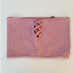 Light Pink Stretchy Bandeau With Criss Cross Front Trendy Bandeau Tube Top For Spring, Spring Bandeau Crop Top, Trendy Pink Bandeau Crop Top, Trendy Pink Strapless Tube Top, Trendy Pink Crop Top Tube Top, Pink Stretch Crop Tube Top, Spring Bandage Tube Top, Casual Pink Strapless Crop Top, Spring Bandage Bandeau Crop Top