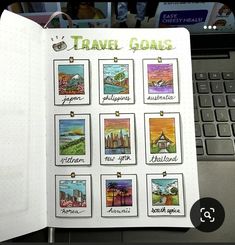 an open notebook with stamps on it and some pictures in front of a computer keyboard