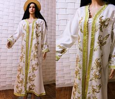 Elevate your style with our exquisite white vintage Moroccan kaftan, adorned with delicate floral embroidery. This classic piece is complemented by a stunning white vintage cape, creating a timeless and elegant combination. Whether you're preparing for a special occasion or just want to infuse your wardrobe with Moroccan charm, this ensemble captures the essence of tradition and sophistication. Be the epitome of grace and style in this unique and versatile outfit, perfect for any event or everyday elegance. measurements  bust : 106cm/41'' length:130/51'' would fit S and M Spring Wedding Kaftan With Intricate Embroidery, Festive White Kaftan With Gold Embroidery, Elegant White Kaftan For Festival, Summer Wedding Kaftan With Floral Embroidery, White Wedding Kaftan For Summer, Festive White Abaya For Eid, Spring Wedding Embroidered Kaftan, Summer Wedding Floral Embroidered Kaftan, Summer Wedding Long Abaya