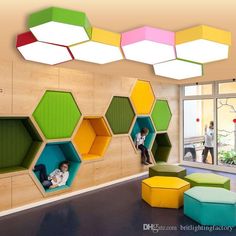 children's playroom with colorful hexagonal shelves and seating