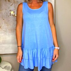 Nwt/Spring Blue In Color/Sleeveless/Round Neck/Tunic Style With Ruffle Bottom/Material 55%Polyester, 40%Rayon, & 5%Spandex Casual Sleeveless Tank Top With Ruffle Hem, Casual Tank Top With Ruffle Hem, Sleeveless Ruffle Hem Top For Vacation, Sleeveless Tops With Ruffle Hem For Vacation, Summer Sleeveless Tank Top With Ruffle Hem, Spring Beach Sleeveless Peplum Top, Sleeveless Cotton Tank Top With Ruffle Hem, Cotton Sleeveless Tank Top With Ruffle Hem, Cotton Ruffle Hem Sleeveless Tank Top