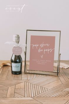 a bottle of wine sitting next to a sign that says stop when the people are married