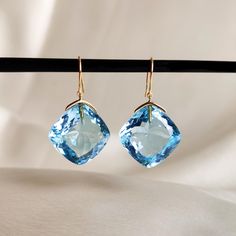 These stunning earrings are set in 14k Solid Yellow Gold with Natural Sky Blue Topaz with utmost precision. It is an unique gemstone earring pair for nearly every occasion and is completely hassle-free jewelry. 🔷 ABOUT GEMSTONE Sky Blue Topaz is a mesmerizing gemstone admired for its serene, clear blue hue, reminiscent of a cloudless sky. Known for its calming energy, Sky Blue Topaz is cherished for enhancing clarity of thought, communication, and self-expression. This stone is linked to the th Luxury Blue Briolette Earrings, Fine Jewelry Light Blue Earrings For Formal Occasions, Light Blue Fine Jewelry Earrings For Formal Occasions, Formal Light Blue Fine Jewelry Earrings, Blue Briolette Earrings For Formal Occasions, Luxury Blue Topaz Drop Earrings, Elegant Aquamarine Briolette Jewelry, Elegant Briolette Aquamarine Jewelry, Yellow Gold Earrings With Blue Topaz Gemstone