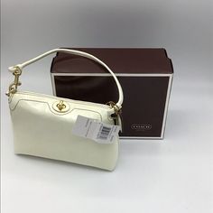 Off White Crinkled Patent Leather Mini Handbag. 7”L X 5”H X 2”W. Removable Strap. Twist Closure. Brass Hardware. Inside Pocket. Can Be Worn As Clutch. Perfect For Carrying Essentials. Excellent Condition. Coach Cream Pouch Shoulder Bag, Cream Box Bag, Coach Cream Shoulder Bag With Top Carry Handle, Coach Cream Clutch Bag, Coach Cream Evening Bag, Coach Rectangular Clutch With Detachable Strap, Coach Clutch With Detachable Strap, Rectangular, Coach Clutch Shoulder Bag With Removable Pouch, Coach Clutch Bags For Daily Use