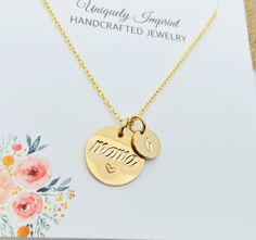 14k Gold filled Mama Necklace.                 This necklace has one 5/8" 14k gold filled disc and up to 6 smaller initial discs that measure 9mm. Necklace comes with a 18" or 20" 14k gold filled cable chain Please provide the following at checkout in message to seller box:                                        -Initial/initials you would like stamped  Each letter has been individually hand stamped. Because of this, the lettering may have slight variations in the spacing, depth of the impressio Gold Hand Stamped Round Disc Charm Necklace, Gold Charm Necklace Gift For Mom, Gold Hand Stamped Necklace For Mom, Gold Hand Stamped Round Charm Necklaces, Gold Hand Stamped Charm Necklaces, Gold Round Hand Stamped Charm Necklaces, Mother's Day Yellow Gold Round Disc Jewelry, Gold Round Disc Charm Necklace For Mom, Gold Round Charm Necklaces Hand Stamped