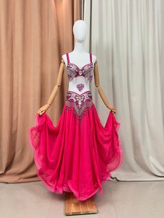 a mannequin wearing a pink and white belly dance dress