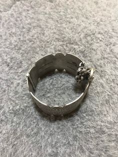 A beautiful old Berber silver bracelet from Morocco. The surface of the bangle has been finely hand-etched with a design combining lines, and the surface as well as interior have both obtained a rich patina from wear and usage. It opens and closes with a pin. Inner diameter : 5,8cm Width : 3,7cm Weight : 83,8g Traditional Engraved Bracelets, Bohemian Sterling Silver Oyster Bracelet, Bohemian Engraved Bracelets For Collectors, Bohemian Etched Bangle Bracelet, Traditional Engraved Collectible Bracelets, Bohemian Engraved Collectible Bracelets, Ornate Stamped Bangle Bracelet, Victorian Etched Cuff Bracelet, Engraved Bohemian Bangle Jewelry