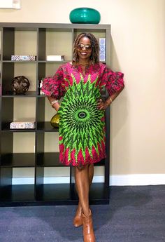 Bright and happy African dress!  Our lovely African print dress has a split neck, 2 side pockets, and an all-around flattering look for every size. XS-Plus sizes. Length-37" Model is 5'7" This dress will be hand crafted for you upon purchase.  *️⃣ FEATURES 🔸Beautiful peplum sleeves 🔸Split neck design 🔸Loose fit Colors: Pink and green  MEASUREMENT GUIDE:  We appreciate you including your bust and hip measurements if not we will use the measurements listed with the size selected. US "2" /UK "6" XXS Bust:31 Hips: 34 US "4"/ UK "8" XS - Bust:32 Hips: 36 US "6"/ UK "10" S - Bust:34 Hips: 38 US "8"/ UK "12" M - Bust:36 Hips: 40 US "10"/ UK "14" L- Bust: 38 Hip: 42 Other sizes sold out 📦 SHIPPING 🔸Processing the order- 1-7 days 🔸USPS First Class - 2-5 days 🔸Expedited shipping available at Green Printed Knee-length Dress, Green Shift Midi Dress, Summer Dresses Green, Peplum Sleeves, Style Vert, Dress African Print, Pink Casual Dress, Women Summer Dresses, Trendy Shirt Designs