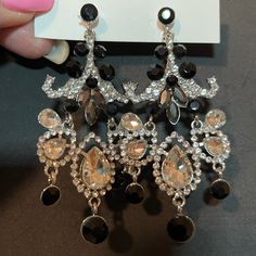 Chandelier Earrings Pageant Earrings Evening Earrings Glamorous Black Jewelry With Sparkling Stones, Black Rhinestone Dangle Jewelry, Black Dangle Rhinestone Jewelry, Black Dangle Jewelry With Rhinestones, Black Drop Clip-on Earrings For Evening, Black Crystal Metal Earrings For Formal Occasions, Black Jewelry With Sparkling Stones For Party, Glamorous Black Metal Earrings, Black Jewelry With Sparkling Stones For Wedding