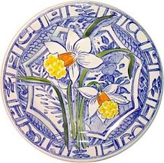 a blue and white plate with flowers on it