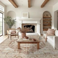 a living room filled with furniture and a fire place in the middle of a room