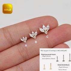 three pairs of gold - plated crystal butterfly stud earrings