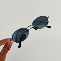 These are mini oval sunglasses featuring a matte silver metal frame with dark blue mirror lens.  This style is unisex.   *These frames are meant to fit small on the face as it was a very popular style in the 90s.  (please read measurements before buying)* 400 uv  Style:  MINI frame Measurements: Lens width: 42mm Lens height: 32mm Bridge: 17mm Arm temple: 140mm new vintage from the 90s includes sunglasses pouch Available in other colors Black https://www.etsy.com/listing/1314896126/ Brown/black h Vintage Black Sunglasses With Mirrored Lenses, Oval Sunglasses 90s, Silver Metal Sunglasses With Tinted Lenses, Retro Silver Sunglasses With Metal Frame, Vintage Silver Sunglasses With Metal Frame, Mini Frames, Blue Mirrors, Oval Sunglasses, Popular Style