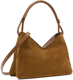 Suede shoulder bag in tan. · Hand-wrapped and knotted detailing at carry handle · Adjustable and detachable leather crossbody strap · Logo embossed at face · Zip closure · Patch pocket at interior · Moiré lining · Logo-engraved gold-tone hardware · H7 x W10 x D3 Supplier color: Tan Staud Crossbody Shoulder Bag With Top Carry Handle, Staud Shoulder Bag With Round Handle For Shopping, Staud Shoulder Bag With Detachable Strap And Round Handle, Staud Bags With Detachable Strap And Round Handle, Luxury Brown Hobo Bag With Rolled Handles, Staud Shoulder Bag With Round Handle, Staud Shoulder Bag With Round Handle For Everyday Use, Staud Top Handle Shoulder Bag, Modern Staud Bag With Top Carry Handle