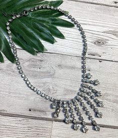 "1950s Vintage Chunky Diamanté Drop Necklace. This amazing 1950s necklace is serving full vintage glamour. Silver metal fixings housing chunky clear diamantes in graduated drop design. Adjustable length from approx 15.5\" - 18.5\" and longest drop in centre measures approx 1.5\" long. Lobster clasp fastening. In very good vintage condition with no missing stones. From our range of vintage jewellery, vintage necklaces and 50s vintage. VIN3576 Please check out our other unique vintage items in our Vintage Jeweled Necklaces For Vintage Events, Vintage Necklace For Vintage Events, Vintage Rhinestone Necklace For Party, Vintage Rhinestone Necklace For Vintage Events, Vintage Crystal Rhinestone Necklace, Vintage Silver Rhinestone Necklace, 1950s Necklace, 1950s Earrings, 1950s Jewelry