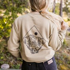 One of our most popular designs now on a new unisex pullover. We always love searching for wildflowers during Montana summers! 80/20 cotton/polyester Body Length 27 28 29 30 31 Chest Width (Laid Flat) 20 22 23 1/2 25 1/2 27 Please note: The pigment-dyeing process gives each garment unique character. Please allow for color variation in production and washing. Care Instructions: Due to the nature of pigment dye, loose pigments may remain on the surface of the garments. We therefore strongly recomm