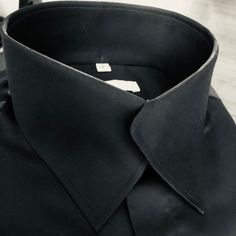 The Morcouture Black Swerve Collar Shirt. 100% Cotton, French Cuffs, Hidden Placket. A Beautiful New Addition To The Morcouture Line. Highly Stylish And Unique. Can Also Be Made In Any Color(Inquire 908 510-5882). From Black Tie Formal To Casual Chic .. The Perfect Neat, No Tie Button Up Collar Shirt. A Definite Head Turner. Shirt Is Full Regular Fit. Luxury Shirt With Concealed Placket And Collar, Luxury Collared Shirt With Concealed Placket, Designer Black Shirt For Business, Fitted Black Top For Formal Occasions, Luxury Fitted Tops For Business, Designer Business Shirt With Fold Down Collar, Designer Business Shirt With Spread Collar, Designer Semi-formal Shirt With Fold Down Collar, Designer Semi-formal Dress Shirt With Spread Collar