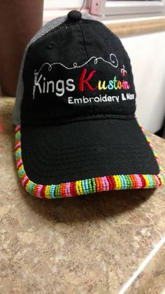 Casual Beaded Cap, Multicolor Trucker Hat As A Gift, Multicolor Trucker Hat As Gift, Casual Beaded Cap Hat, Casual Multicolor Customizable Hats, Multicolor Trucker Hat One Size Fits Most As Gift, Multicolor One Size Trucker Hat As Gift, Black Hat With Custom Embroidery, Customizable Multicolor Trucker Hat