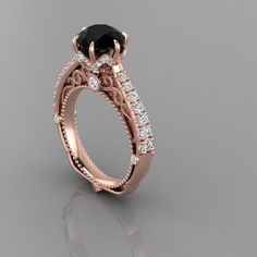 a rose gold engagement ring with an oval cut black diamond surrounded by round brilliant diamonds