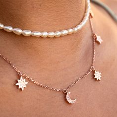 Tap into heavenly realms with our delicate and ultra-chic Moon & Stars drop charm choker necklace.  CZ pave moon & stars charms provide subtle sparkle, along with a faceted rose gold chain that extends from 14 inches to 17 inches. Rose gold over sterling silver. Always remove when showering, swimming, exercising, sleeping. Store in the provided airtight bag to prevent tarnishing. Dainty Moon Necklace, Charm Choker Necklace, Minimal Necklace, Beach Necklaces, Rose Gold Chain, Gold Choker Necklace, Moon Stars, Stunning Necklace, Mens Jewelry Bracelet