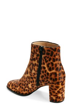 Leopard-print genuine calf hair brings statement-making style to this versatile bootie boosted by a block heel. 2" heel 4 3/4" shaft Side zip closure Genuine calf hair (Myanmar) upper/synthetic lining and sole Imported Fabric Gift Bags, Calf Hair, Fabric Gifts, Nordstrom Store, Free Fabric, Myanmar, Side Zip, Bootie, Steve Madden