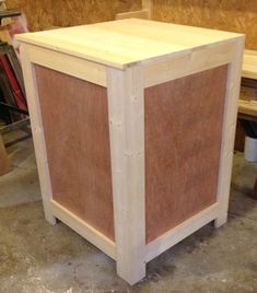 an unfinished cabinet is sitting on the floor