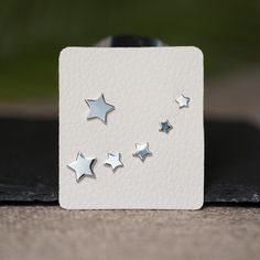 Sterling silver tiny star stud earring in variable sizes. Perfect earrings set for multiple piercings earring to layer and add extra sparkle! - Silver star stud earrings, Star stud earring gold, Star stud earring silver, Star Earrings Stud, Star earring, silver star studs, gold star earrings, starburst studs, starburst earrings - Qty: 3 pairs per set - Dimension: Variable sizes ranging from 4 mm to 9 mm in diameters - Material: 925 sterling silver, 14 K gold plated on 925 sterling silver, hypoal Silver Star-shaped Pierced Cartilage Earrings, Minimalist Sterling Silver Nose Studs For Gifts, Nickel-free Star-shaped Silver Piercings, Minimalist Silver Star Piercings, Nickel Free Silver Star-shaped Piercing, Silver Star Single Stud Earring, Silver Star-shaped Cartilage Earrings With Pierced Design, Sterling Silver Star-shaped Piercings, Silver Star-shaped Sterling Silver Piercings