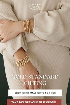 a woman wearing gold bracelets with the text, gold standard gifting shop christmas gifts for her take 20 % off your first order