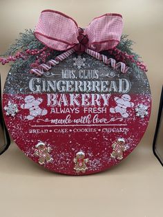 a red and white sign that says gingerbread bakery