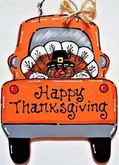 an ornament that says happy thanksgiving with a turkey in the back of a truck