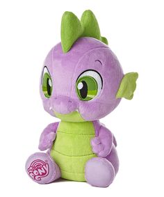 a purple and green stuffed animal with big eyes