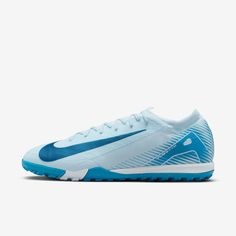 a blue and white nike soccer shoe on a white background with the word nike written across it