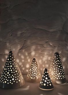 three black and white polka dot lamps sitting next to each other