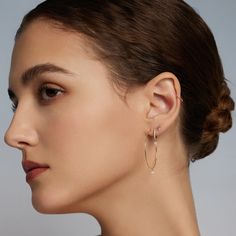 Inspired by the lively tempo of music, these exquisite earrings dance with brilliance. Each carefully set diamond creates a symphony of sparkle, adding a touch of glamour and grace to every movement. Product Details: Material: 14K Solid Gold Outer Diameter: 10.0mm Inner Diameter: 8.5mm Thickness: 1.2-1.5mm Stone Type: Diamond Diamond Size: 2.5mm Total Weight: 1.555g Total Carat Weight: 0.136ct Floating on Air Collection: Discover the ethereal elegance of 'Floating On Air,' a mesmerizing diamond Elegant Rose Gold Hoop Earrings For Everyday Luxury, Diamond White Marquise Earrings, Marquise Diamond White Earrings, Diamond Hoop Earrings In Yellow Gold For Evening, Yellow Gold Diamond Hoop Earrings For Evening, Timeless Diamond Hoop Earrings With Single Diamond, Elegant Marquise Diamond Earrings With Accents, Elegant Marquise Earrings With Diamond Accents, Elegant Yellow Gold Hoop Earrings With Diamond