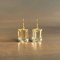 The glistening champagne tones in these opulent citrines will make every day a soirée. 18k gold setting, 14k gold ear wiresCitrines 13mm x 16mm (1/2" x 5/8")Earrings hang 1 1/8" from the ear Each earring weighs 3.3g Luxury Yellow Gold Citrine Earrings, Formal Yellow Gold Topaz Earrings, Yellow Citrine Earrings For Formal Occasions, Formal Yellow Citrine Earrings, Gold Faceted Earrings For Evening, Elegant Formal Citrine Earrings, Formal Topaz Earrings, Luxury Gold Topaz Earrings, Formal Amber Citrine Earrings