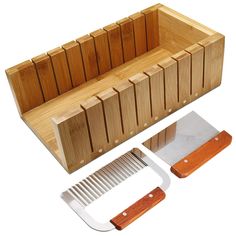 a wooden comb holder with two knives and a cutting board