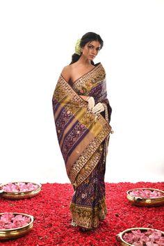 Indulge in the delicate beauty of this Authentic Pure silk Patan Patola Gota Patti Saree. Hand-embroidered in eye-catching Purple, it perfectly captures heritage elegance with a modern flair. Luxuriously soft and radiant, it is sure to make a statement at any event. Gold Silk Pre-draped Saree With Intricate Embroidery, Gold Silk Saree With Intricate Embroidery, Transitional Season Silk Saree With Intricate Embroidery, Luxury Embroidered Traditional Wear, Elegant Multicolor Embroidered Traditional Wear, Silk Pre-draped Saree With Intricate Embroidery For Transitional Season, Elegant Festive Traditional Wear With Multicolor Embroidery, Elegant Multicolor Embroidered Traditional Festive Wear, Elegant Banarasi Silk Blouse With Intricate Embroidery