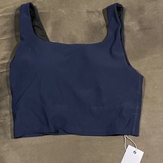 Tank Top With Built In Bra, Casual Solid Color Nylon Sports Bra, Blue Nylon Activewear With Seamless Construction, Blue Seamless Nylon Activewear, Blue Seamless Nylon Sports Bra, Casual Blue Elastane Tank Top, Blue Nylon Sports Bra With Medium Support, Blue Nylon Top With Built-in Bra, Blue Medium Support Nylon Sports Bra