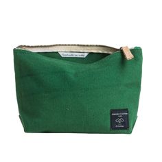 a green bag with a zipper on it