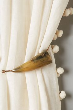 a banana sticking out of the side of a curtain