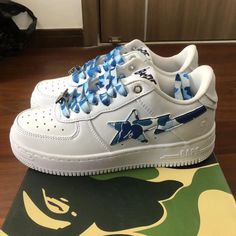 New In Box.The 2021 Bape Sta Sneaker By A Bathing Ape In Blue And White Also Has A Branded Tongue Tag Accentuating The Blue And White Colors, Which Is In Line With The Abc Camo Glossy Patent Leather Aesthetic And The Iconic Bape Emblem Embossed At The Product’s Lateral.The A Bathing Ape Bape Sta Abc Camo White Blue 2021features A Classic Bape Camouflage Motif That Shapes Its Design. Bape Sta Shoes, Swaggy Shoes, Bapesta Shoes, Leather Aesthetic, Bape Shoes, Bape Sneakers, Bape Sta, Sneaker Heads, Pretty Sneakers